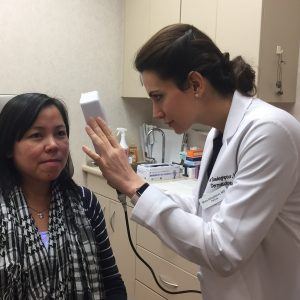 Dr. Sadeghpour assessing melasma patient