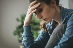 Photo of woman with under eye dark circles that make her look tired