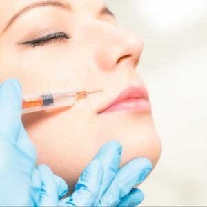 Woman getting a filler injection