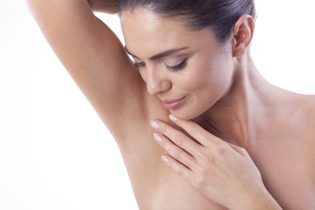 Close up of woman satisfied with the laser hair removal on her armpit