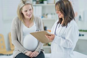 Pregnant woman with her dermatologist