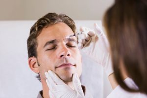 Man receiving cosmetic injection