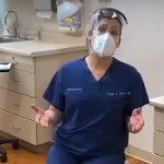 Dr. Travers wearing mask and face shield for an on-site patient visit