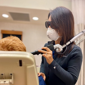 Dermatologist doing a PicoToning treatment