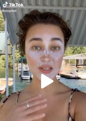 Girl explaining sunscreen contouring on TikTok