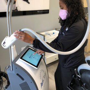 SkinCare Physicians nurse getting AviClear laser device ready for acne treatment