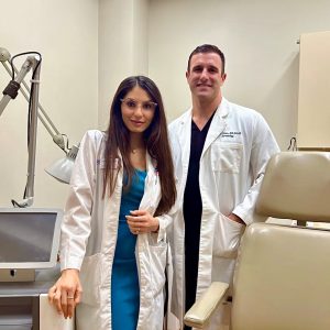 Drs. Nicole Salame and John Peters in an exam room at SkinCare Physicians