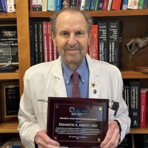 Dr. Arndt with his Kenneth A. Arndt, MD Lifetime Mentorship Award from ASLMS