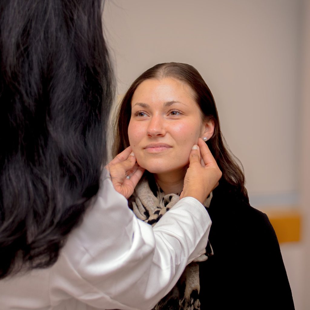 Dr. Christman explaining Botox and filler injection to patient