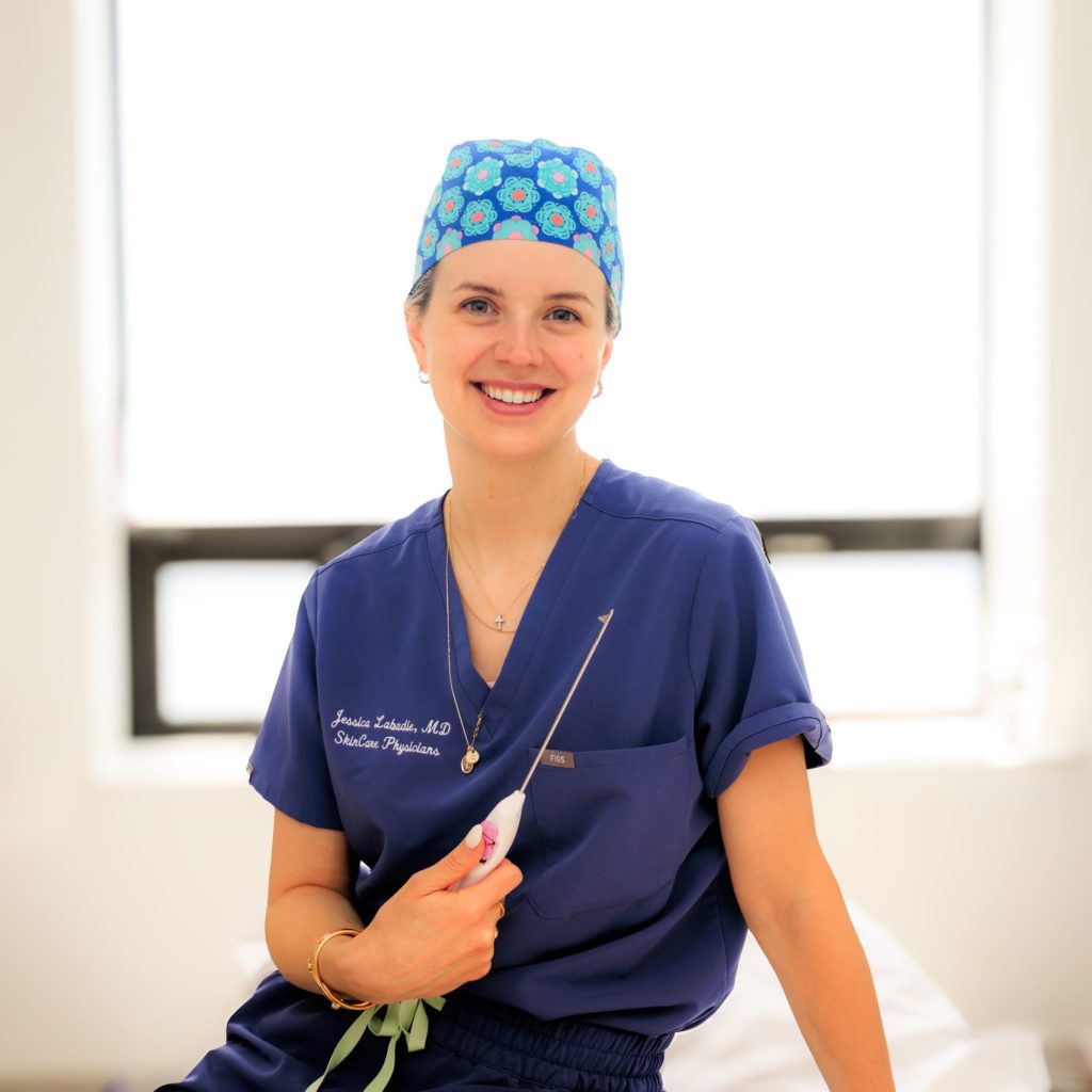 Dr. Labadie holds the Aveli device to treat cellulite.