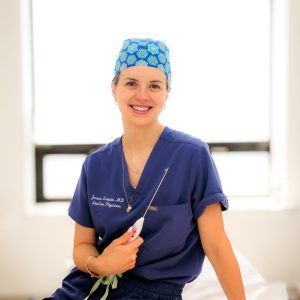 Dr. Labadie holds the Aveli device to treat cellulite.