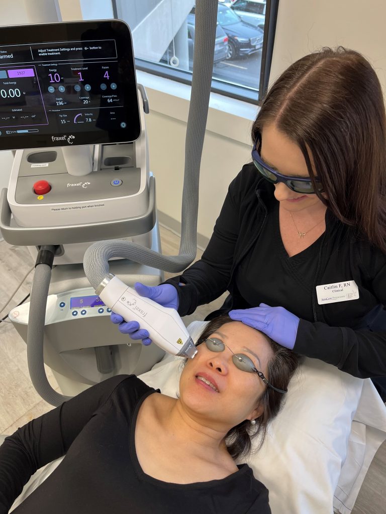Nurse treating patient with the Fraxel FTX