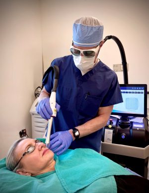 Dr. Rohrer treating a woman with UltraClear