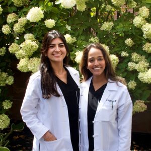 Dr. Prachi Aggarwal and Dr. Sarah Millan outside of SkinCare Physicians